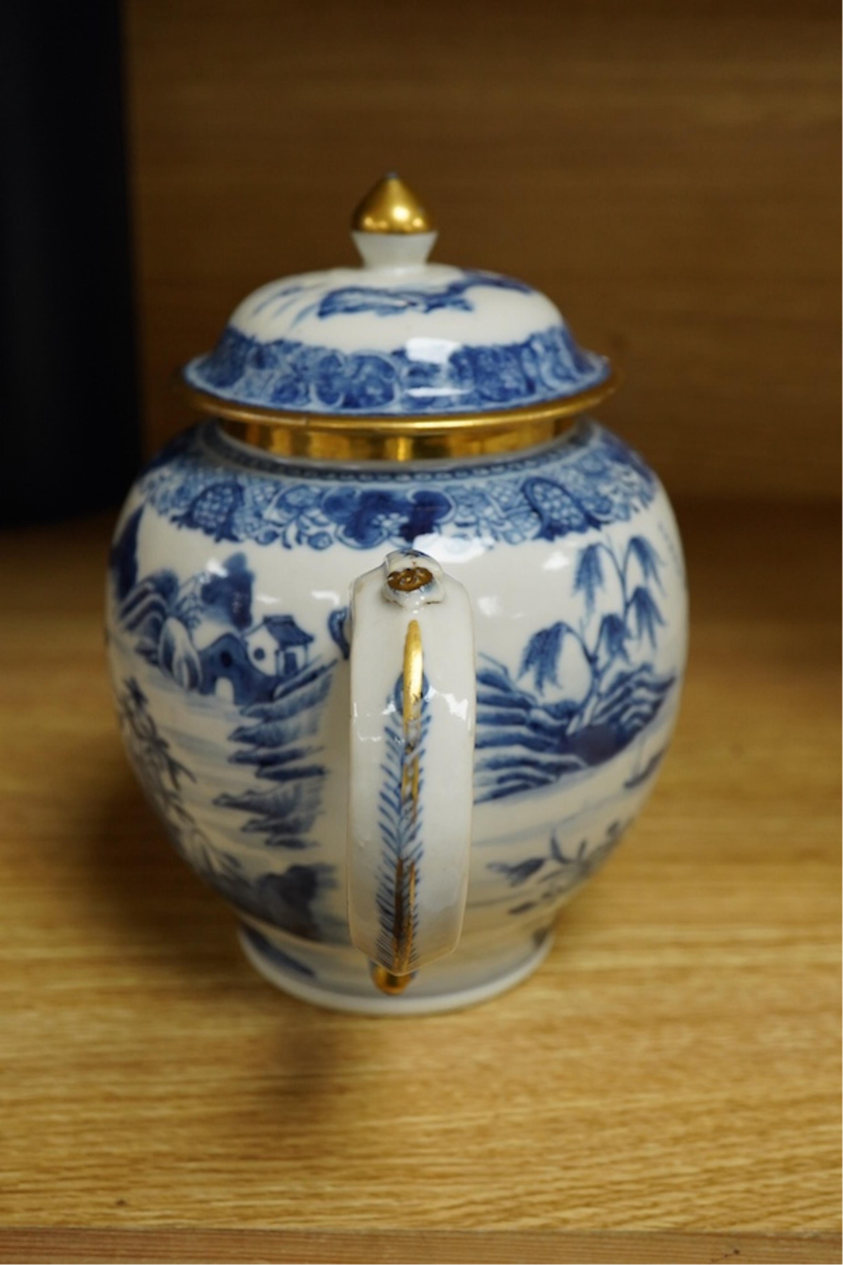 A Chinese export blue and white teapot, c.1790, painted with pagodas, 24cm wide. Condition - some chipping and firing cracks